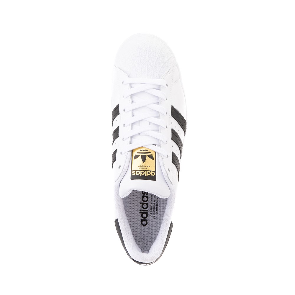 white and black adidas superstar